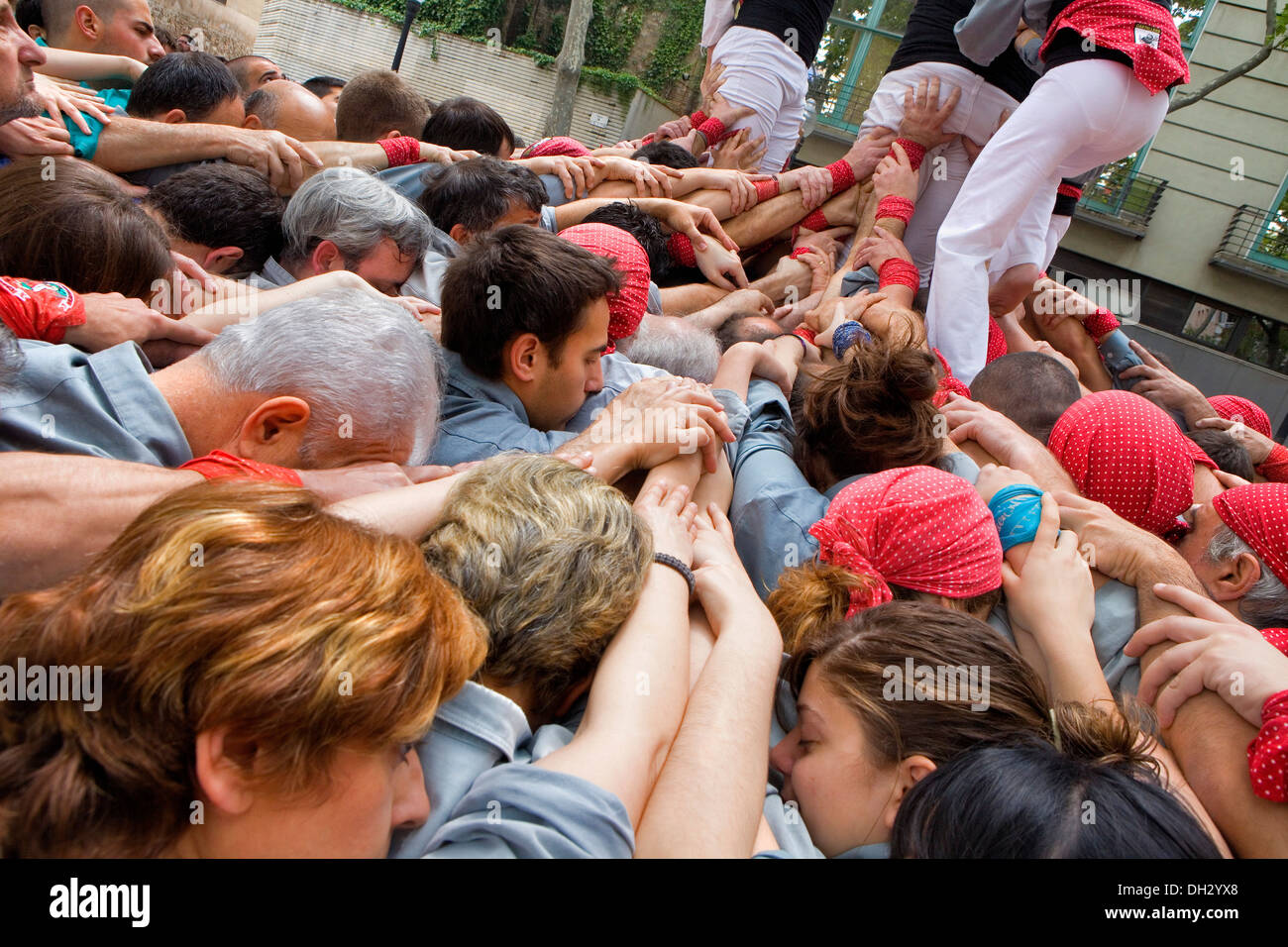 Castellers de Sants.'Castellers' building human tower, a Catalan tradition. Plaça Bonet i Moixi.Barcelona, Spain Stock Photo