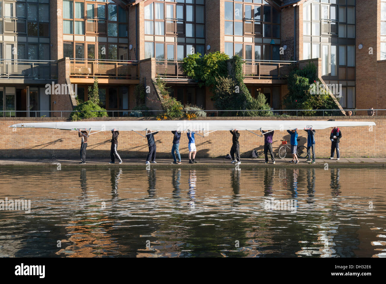 Cambridge, UK. 30th Oct, 2013. Rowers carry their boats back to the boathouses after an early morning row Cambridge UK 30th October 2013. After a cold night with one of the first frosts of the year Cambridge basks in glorious autumn sunshine. Credit Julian Eales/ Alamy Live News Stock Photo
