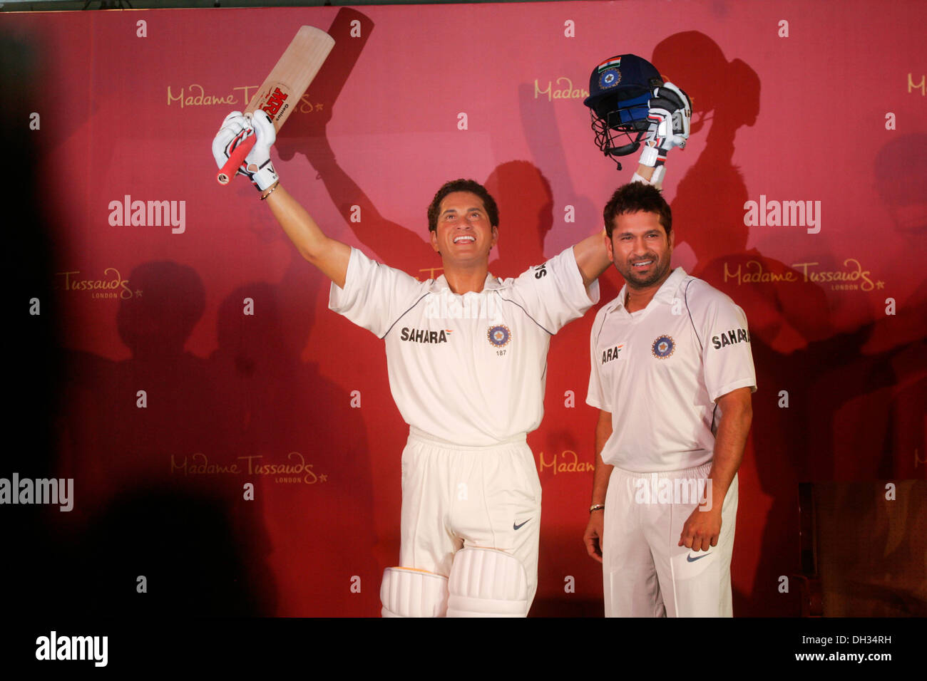 Indian Cricketer Sachin Tendulkar poses with his wax statue Stock Photo