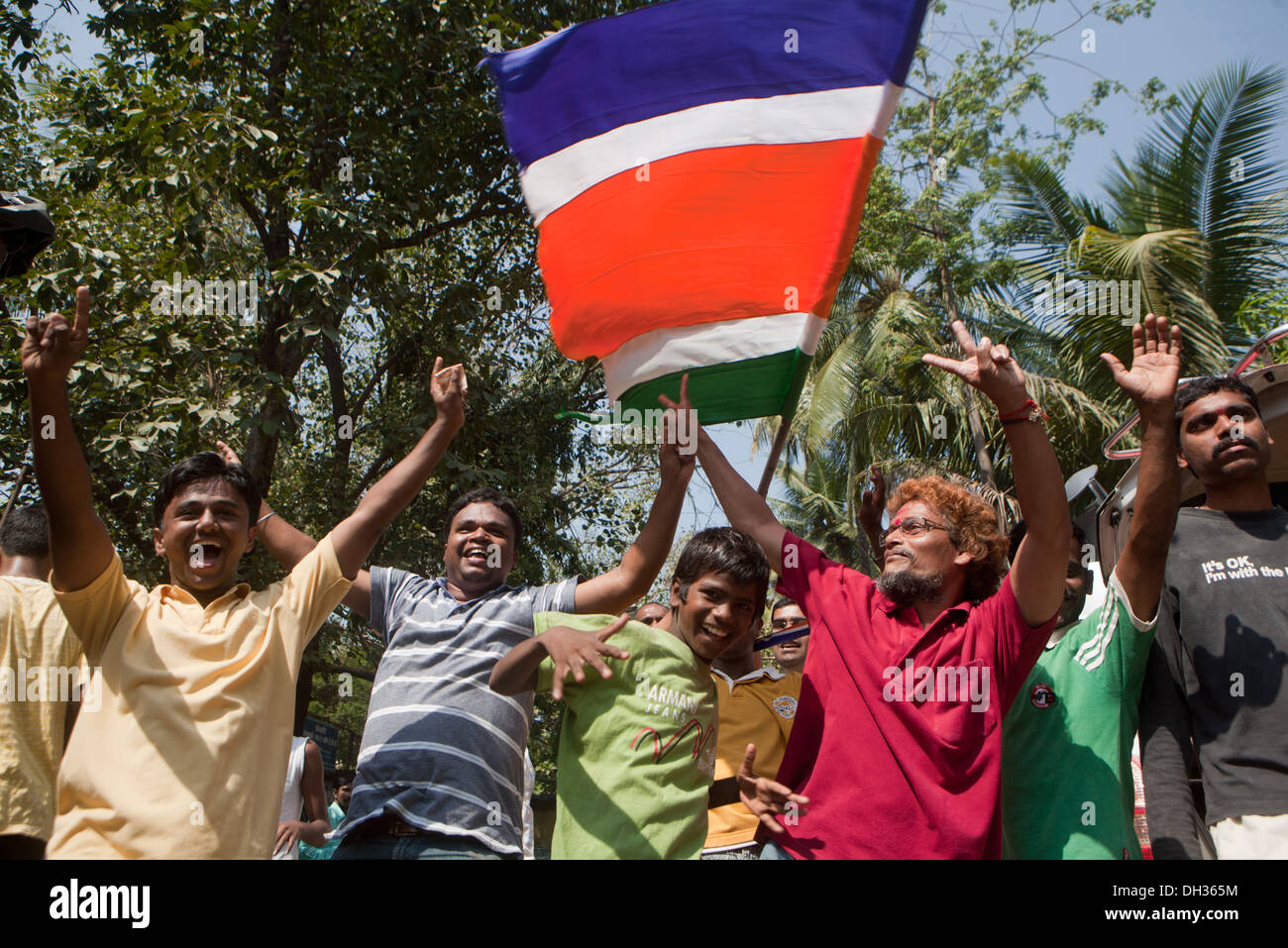 men supporters dancing shouting slogans celebrating election victory of MNS candidate Mumbai Maharashtra India Asia Stock Photo