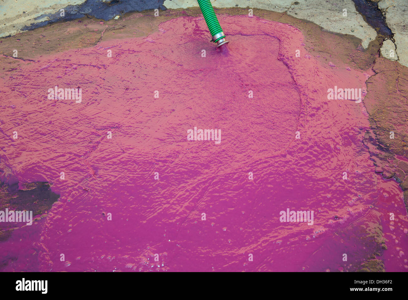 Wine vinasse rich in tartaric acid in magenta pink color cleaning the dregs of barrels Stock Photo