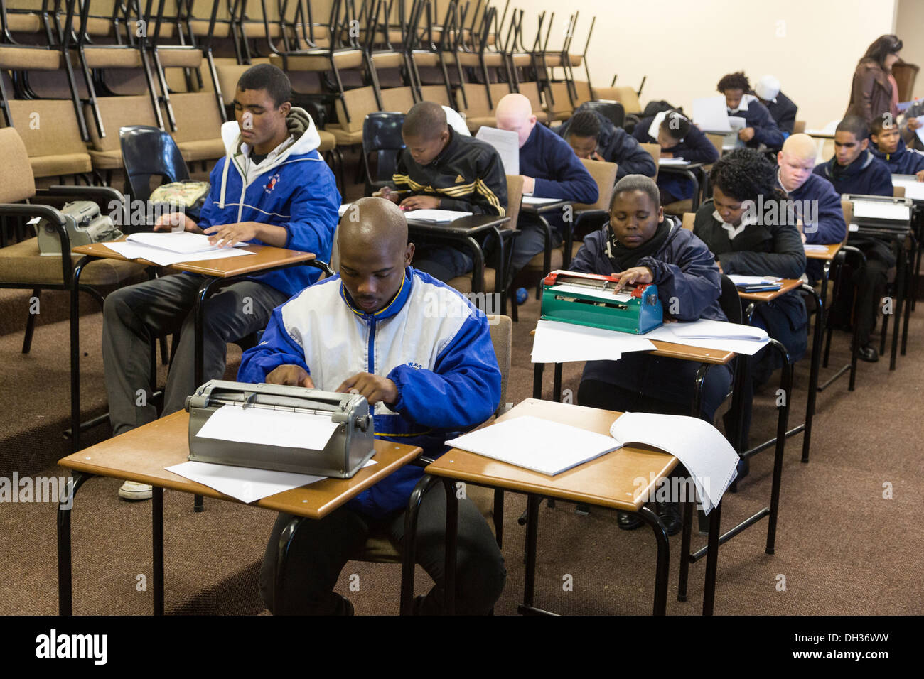 South Africa, Cape Town. Blind Students Typing on Perkins Brailler or Reading Braille with