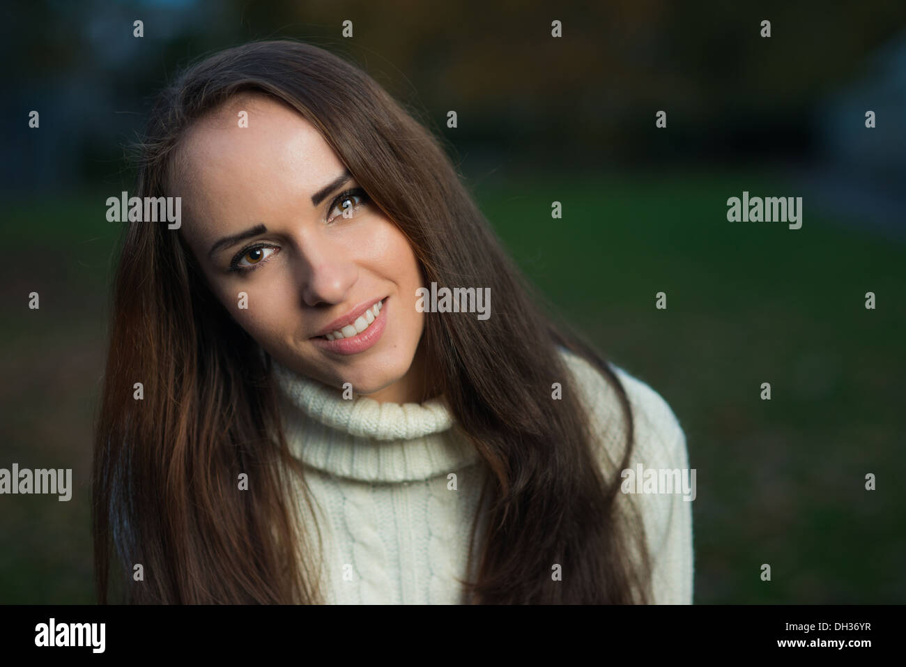 Young woman in a park during autumn Stock Photo - Alamy