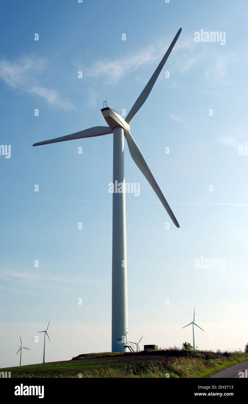 wind turbine on blue sky background Stock Photo - Alamy