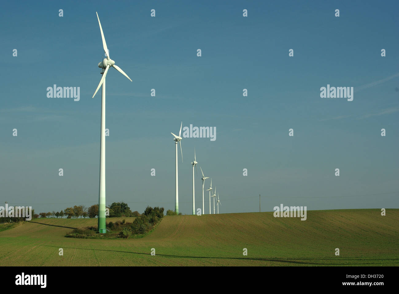 wind turbine on blue sky background Stock Photo - Alamy