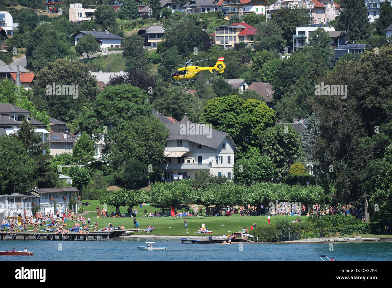 A rescue helicopter lands at the holiday resort of Velden am Worthersee in Austria Stock Photo