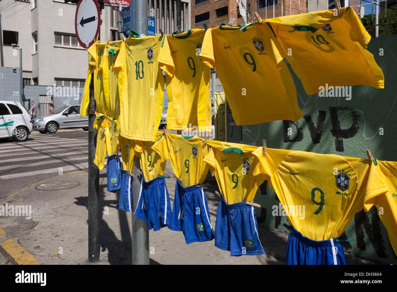 Brazil football shirts and shorts in national football soccer colours on sale on a street before a match, Fortaleza, Brazil Stock Photo