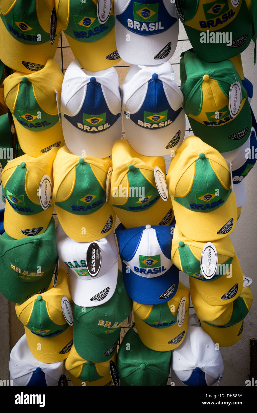 Brazil yellow and green caps on sale on a street stall, Copacabana, Rio de Janeiro, Brazil Stock Photo