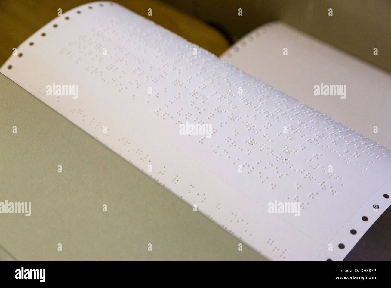 South Africa, Cape Town. Pages Coming out of a Braille Printer. Athlone