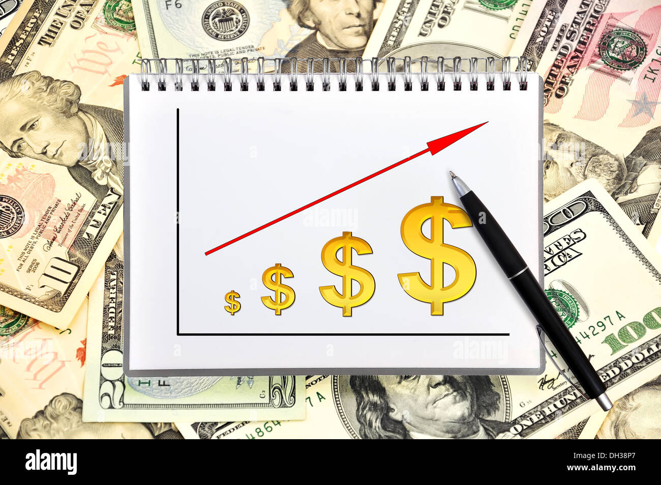 notebook with chart on a money background Stock Photo