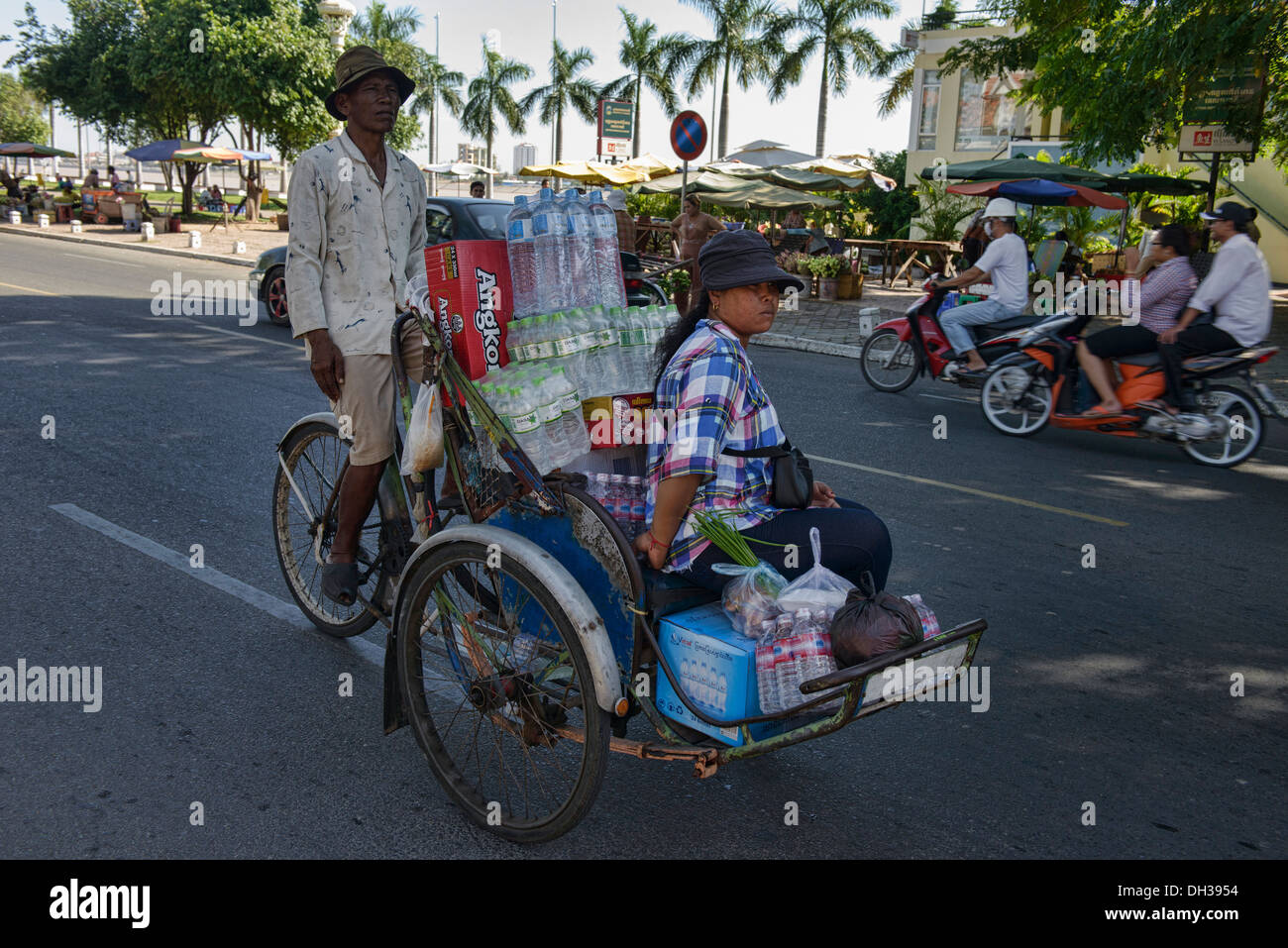 traveling by cyclo, Phnom Penh, Cambodia Stock Photo