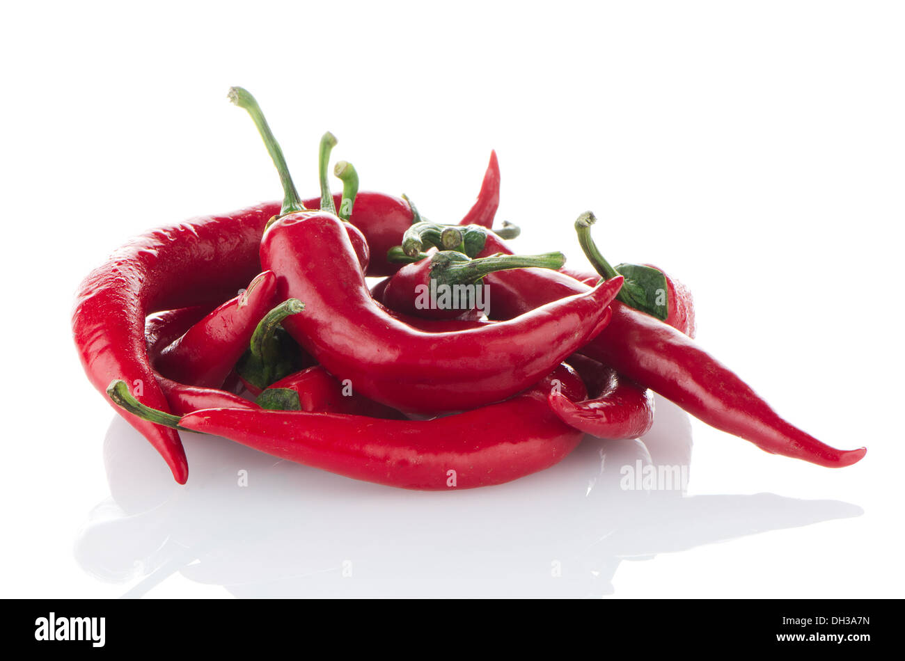 Some red hot peppers on a white background Stock Photo - Alamy