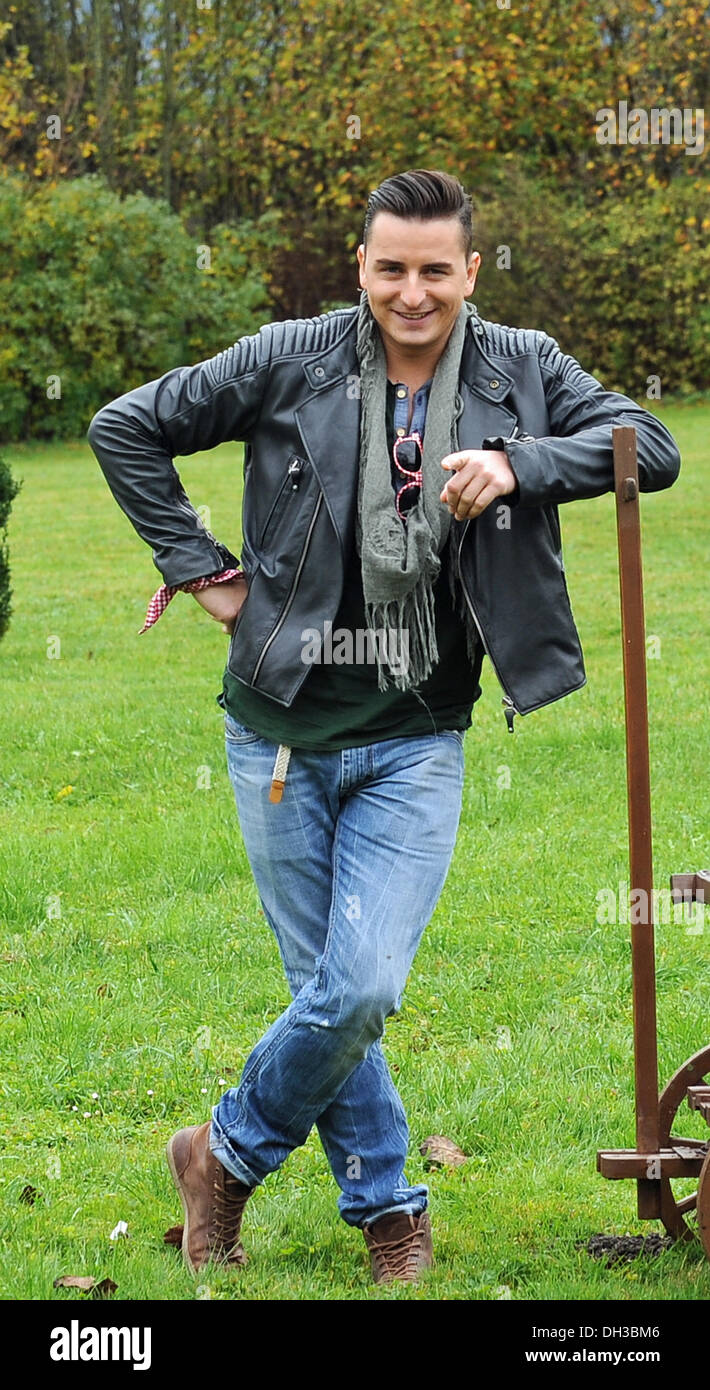 Oberaudorf, Germany. 30th Oct, 2013. Austrian singer Andreas Gabalier poses in his first film role as pop musician Fabrizio Frey during a break at the set for the 300th episode of the ZDF crime series 'Die Rosenheim-Cops' at the Reisach cloister near Oberaudorf, Germany, 30 October 2013. Photo: Ursula Dueren/dpa/Alamy Live News Stock Photo
