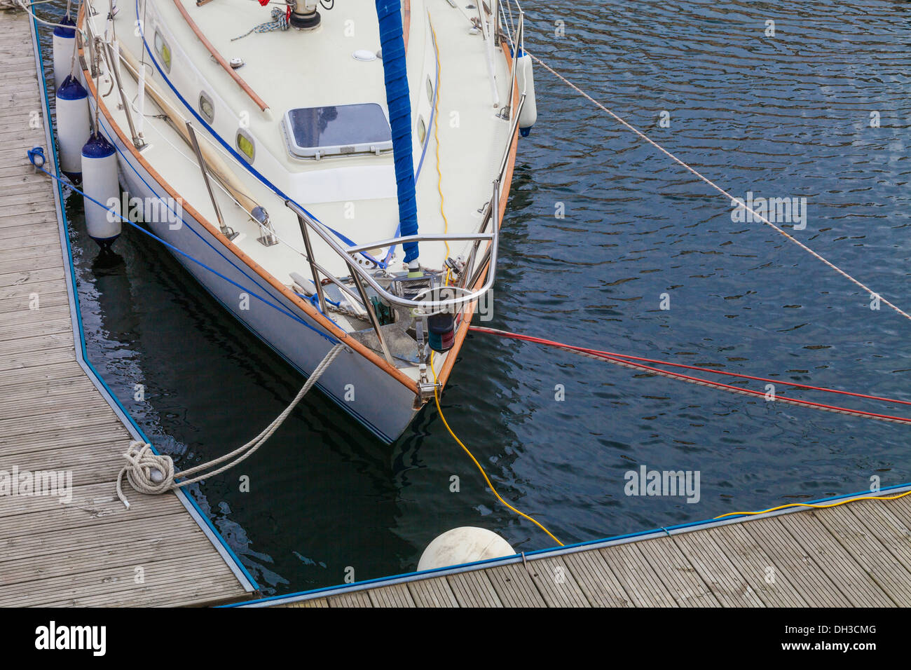 A small sailboat moored at Lossiemouth Harbour, Lossiemouth, Scotland. Stock Photo
