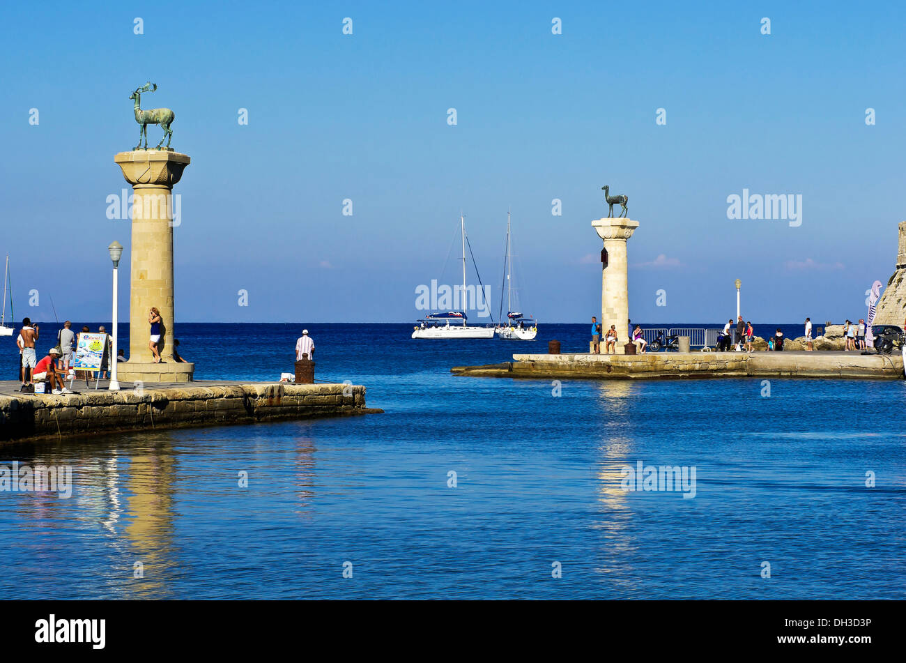 Harbour entrance of Rhodes with Elafos and Elafina, sculptures of a deer buck and a doe on columns, Mandraki harbour, Rhodes Stock Photo