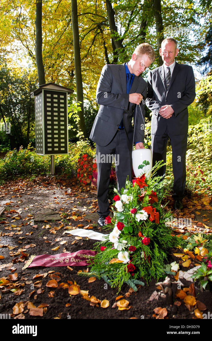 Saarbruecken, Germany. 22nd Oct, 2013. The undertakers Hubert Laubach (R) and Hubert Marc Laubach stand in the area for forest burials of the main cemetery in Saarbruecken, Germany, 22 October 2013. The two undertakers found voluntary mourners for decendents without relatives. Photo: Oliver Dietze/dpa/Alamy Live News Stock Photo