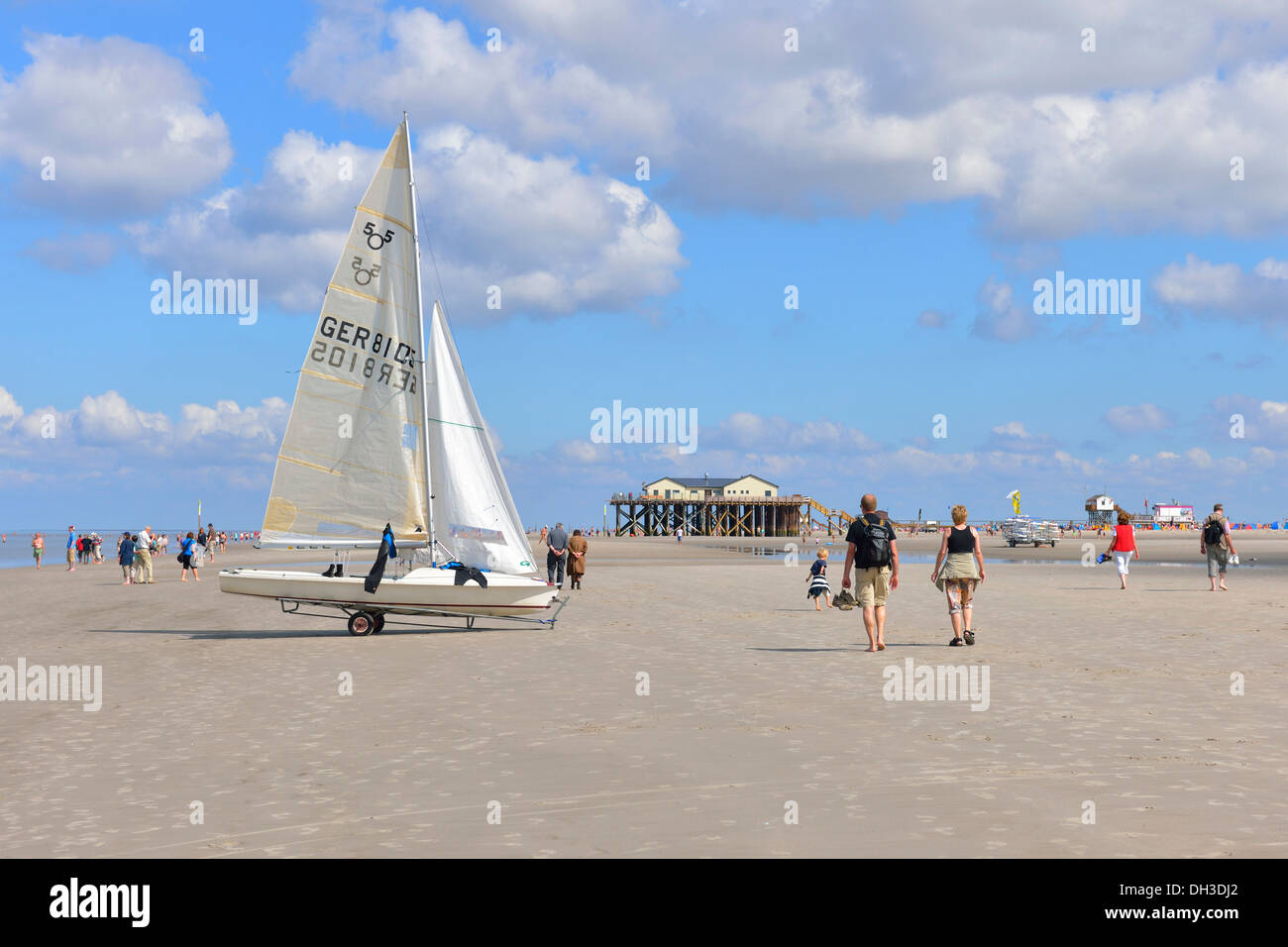 Yacht and stilt house with Strandbar 54 beach club on the beach of St. Peter-Ording, Eiderstedt, Schleswig-Holstein Stock Photo