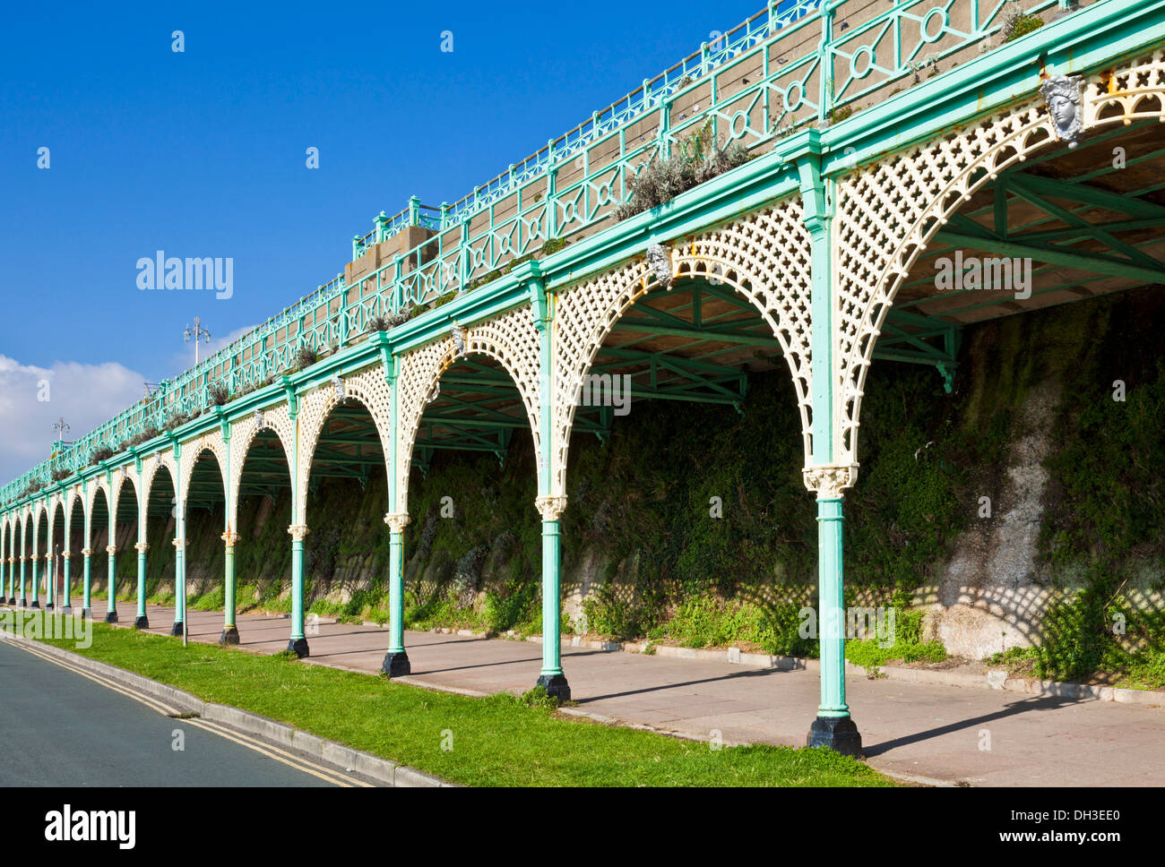 Ornate iron lacework of the arches on Madeira drive Brighton East Sussex England GB UK EU Europe Stock Photo
