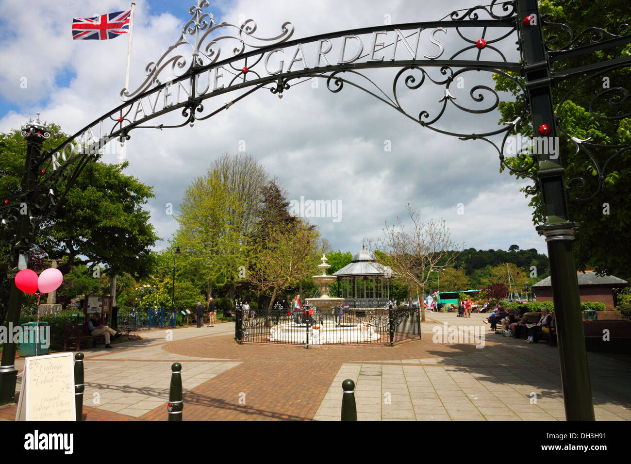 A Park With A Bandstand And Wrought Iron Sign Above Union Jack Flag a-park-with-a-bandstand-and-wrought-iron-sign-above-union-jack-flag