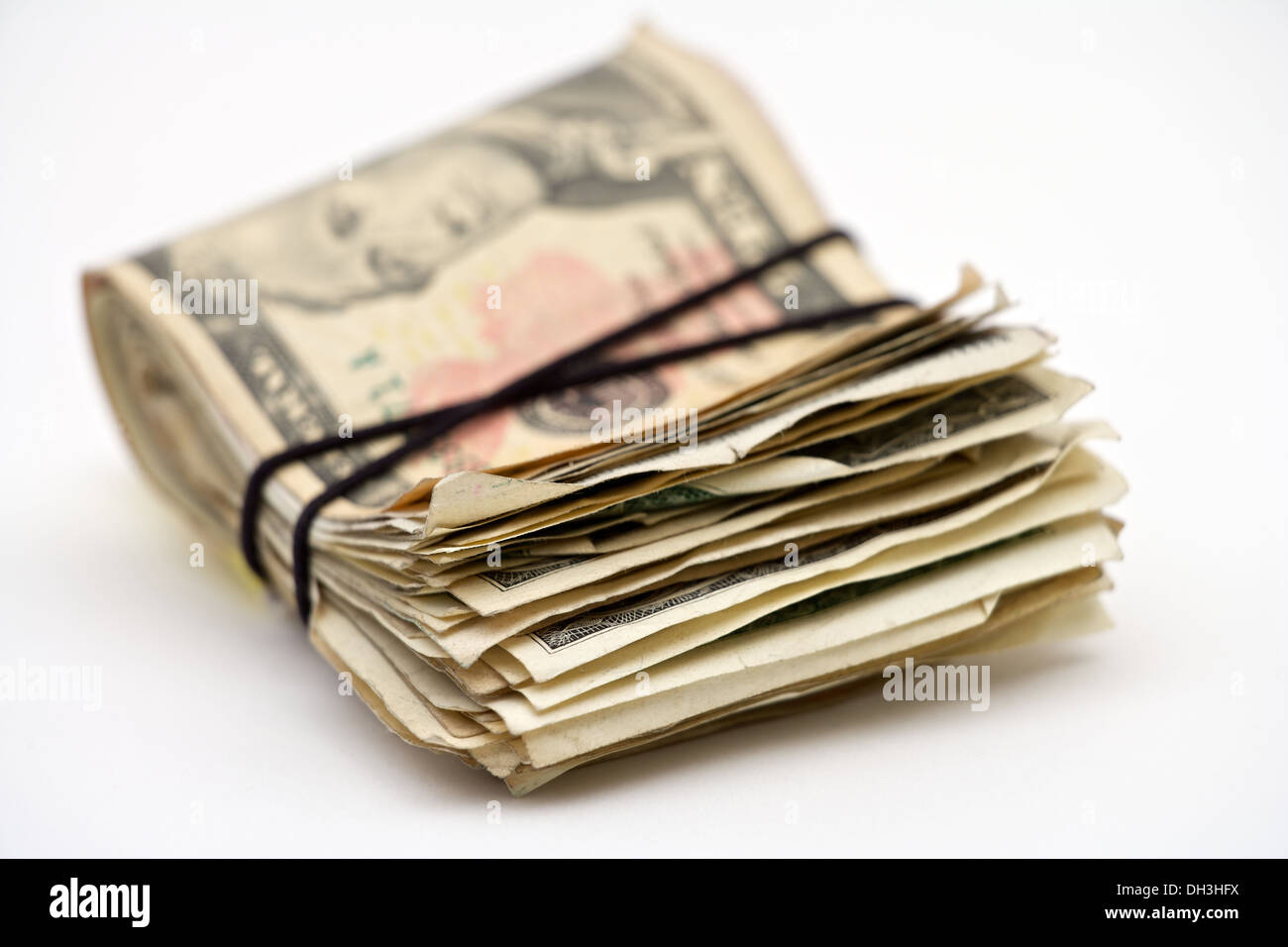Closeup of a wad of American money tied together with a rubber band Stock Photo