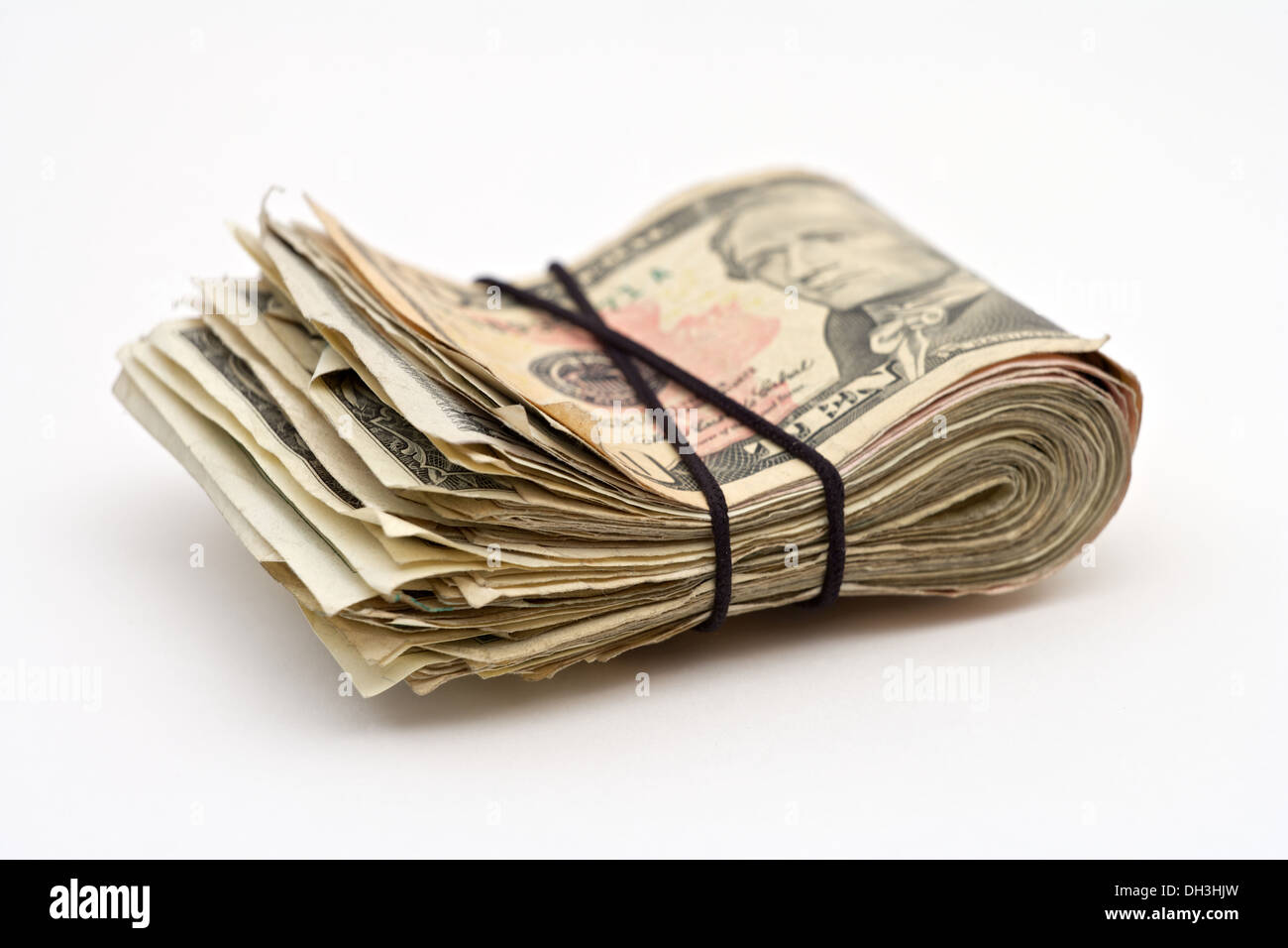 Closeup of a wad of American money tied together with a rubber band Stock Photo