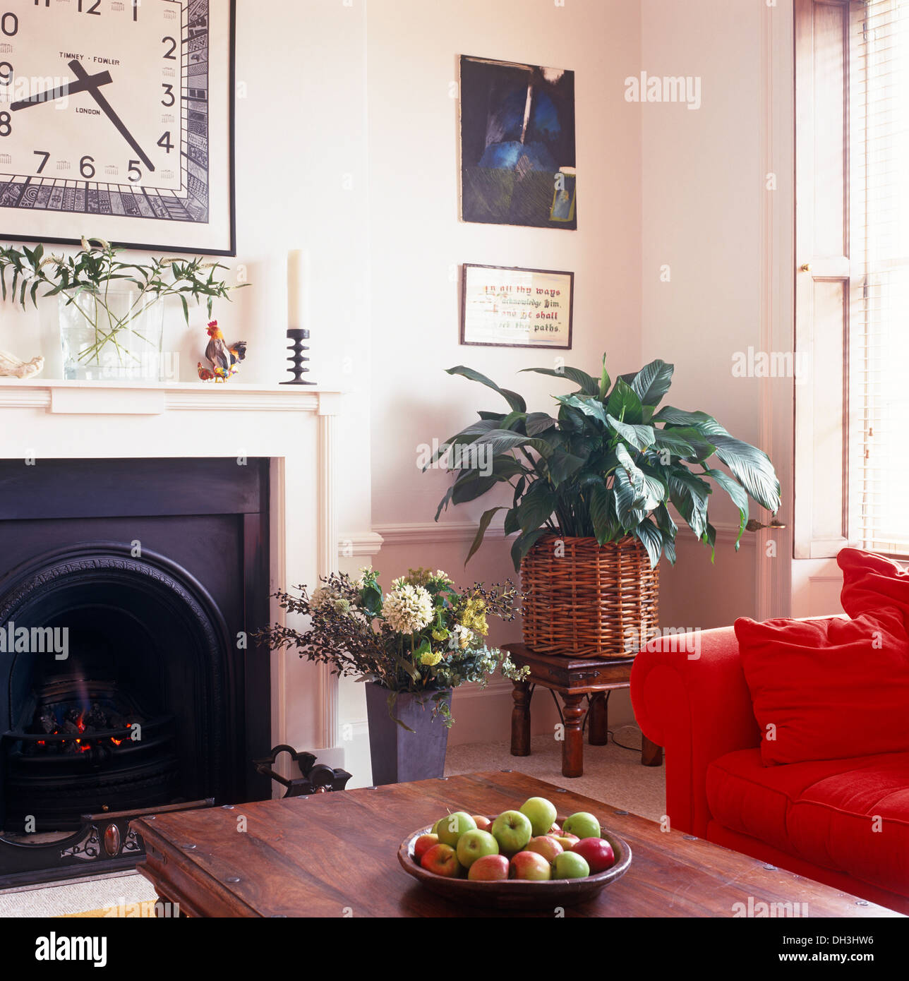 Wood Coffee Table In Front Of Fireplace Below Oversize Clock In