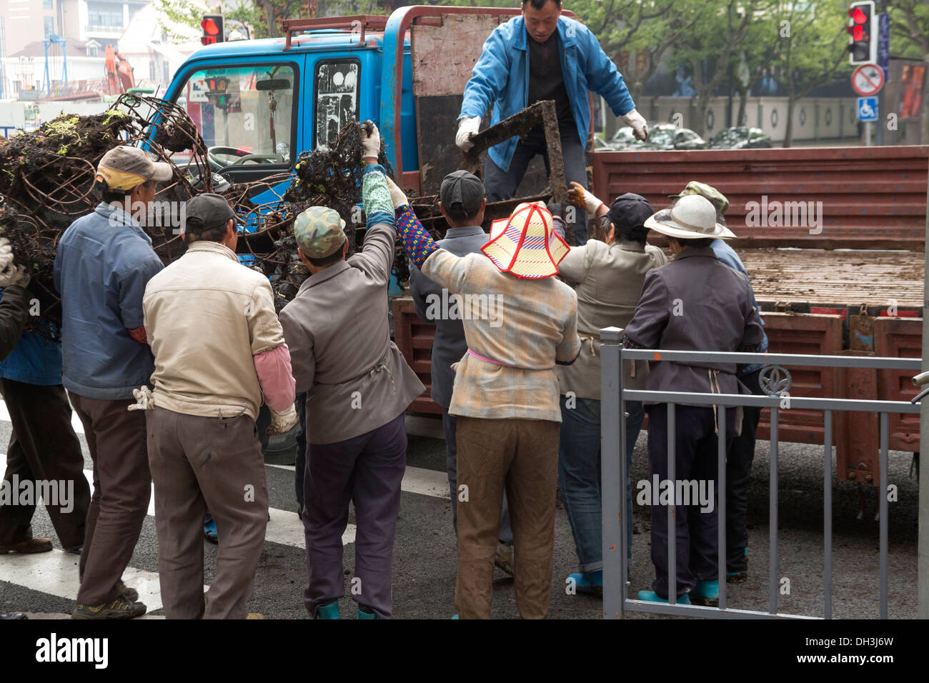 Team of workers removing iron structure Stock Photo