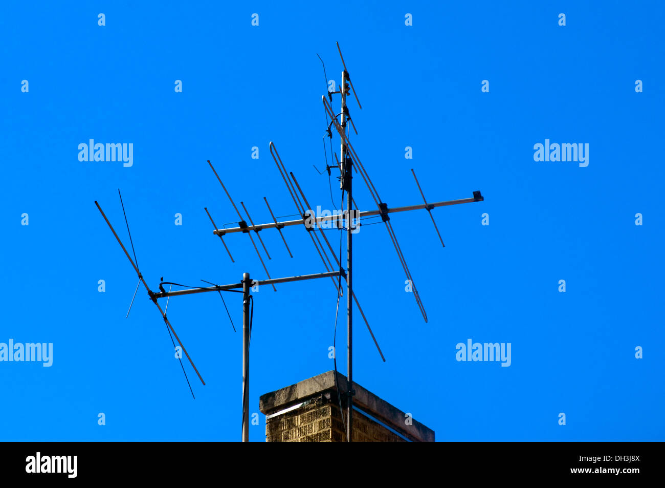 Television, radio antenna attached to a home chimney. Stock Photo