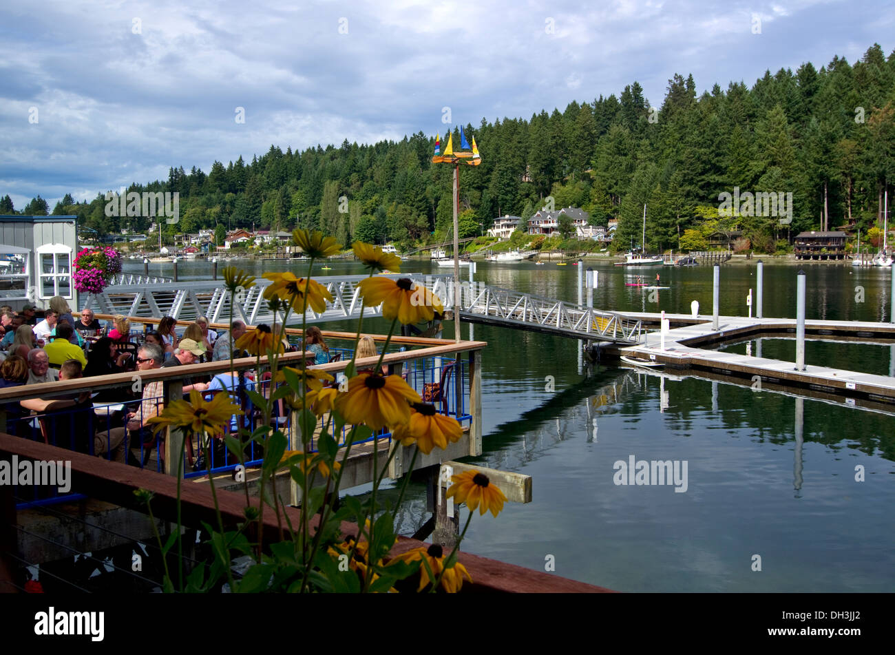 Water activities in front of the Tides Tavern Gig Harbor Washington Stock Photo