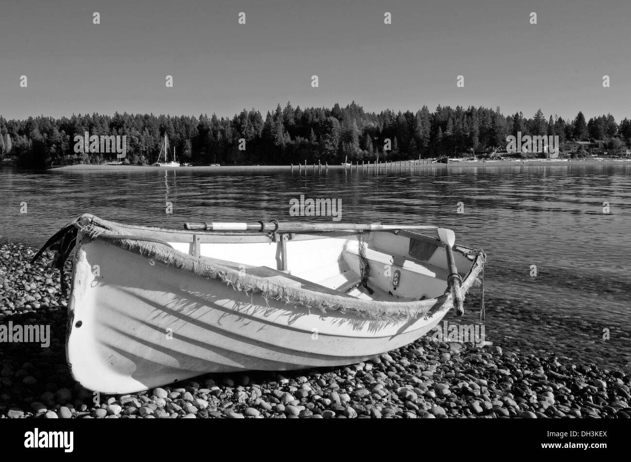 Dory dinghy on rocky beach Puget Sound Washington Stock Photo