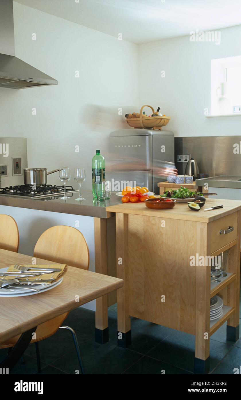 Pale Wood Butcher S Block In Modern White Kitchen With Stainless