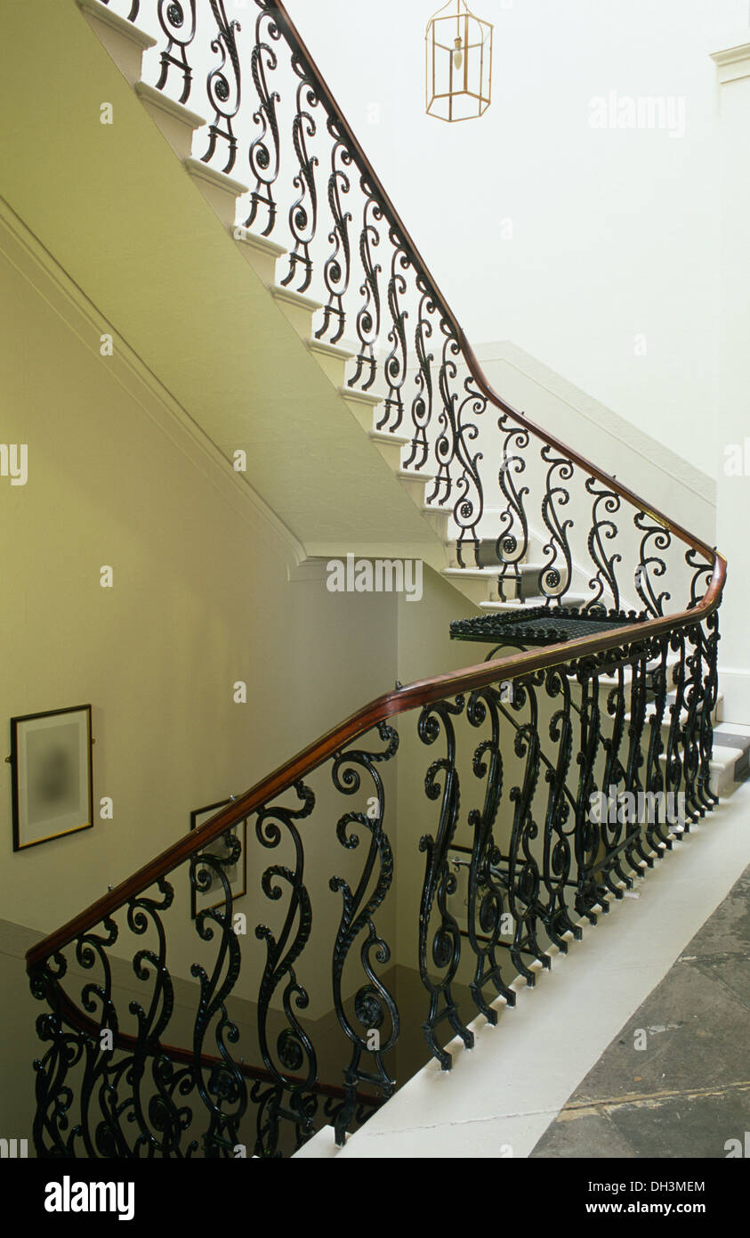 Ornate Wrought Iron Banister In On Staircase And Landing In