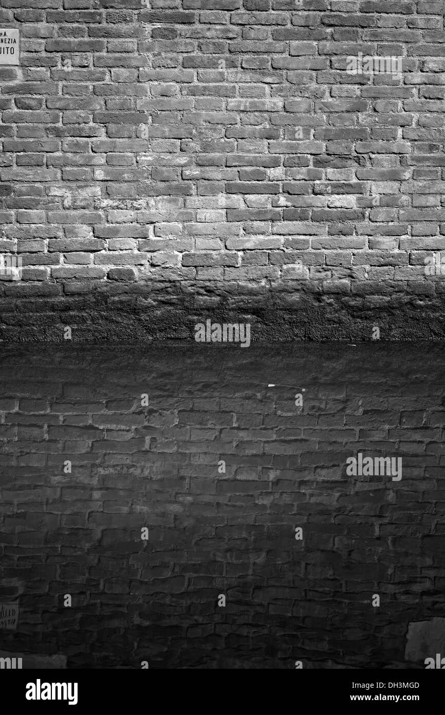 Brick wall, a facade on a channel, black-and-white image, Venice, Veneto, Italy, Europe Stock Photo