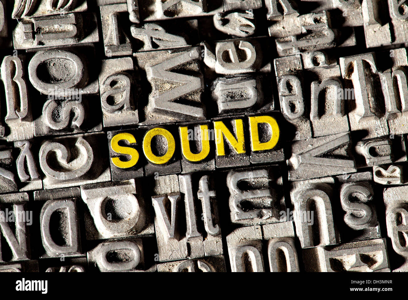 Old lead letters forming the word 'SOUND' Stock Photo