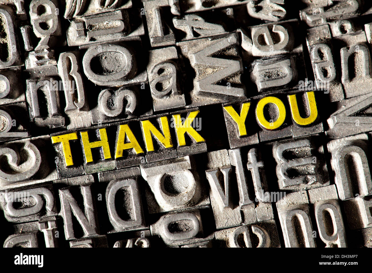 Old lead letters forming the words 'THANK YOU' Stock Photo