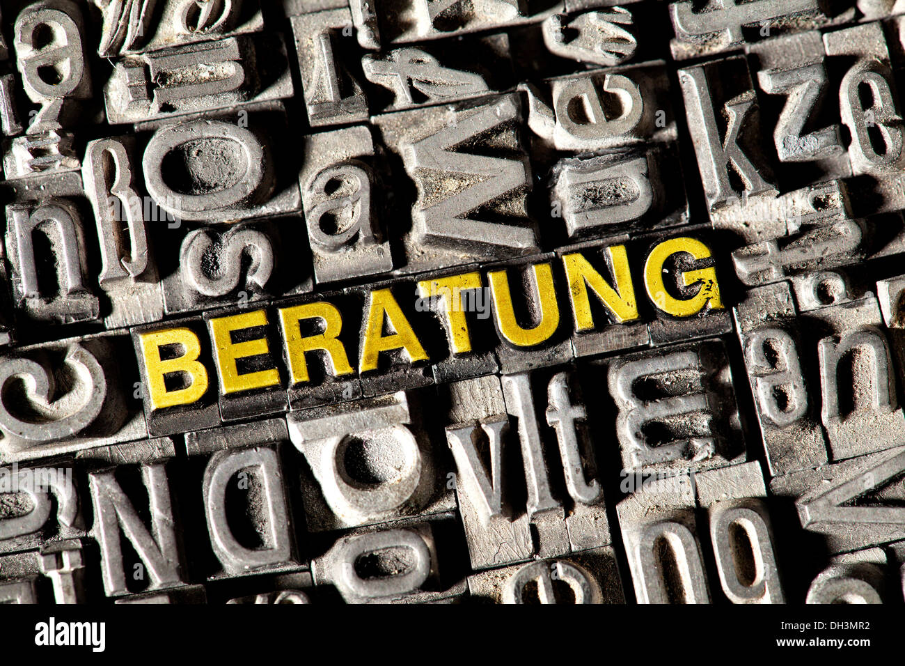 Old lead letters forming the word 'BERATUNG', German for 'ADVICE' Stock Photo