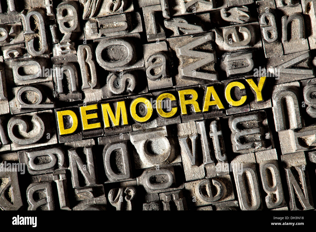 Old lead letters forming the word 'democracy' Stock Photo
