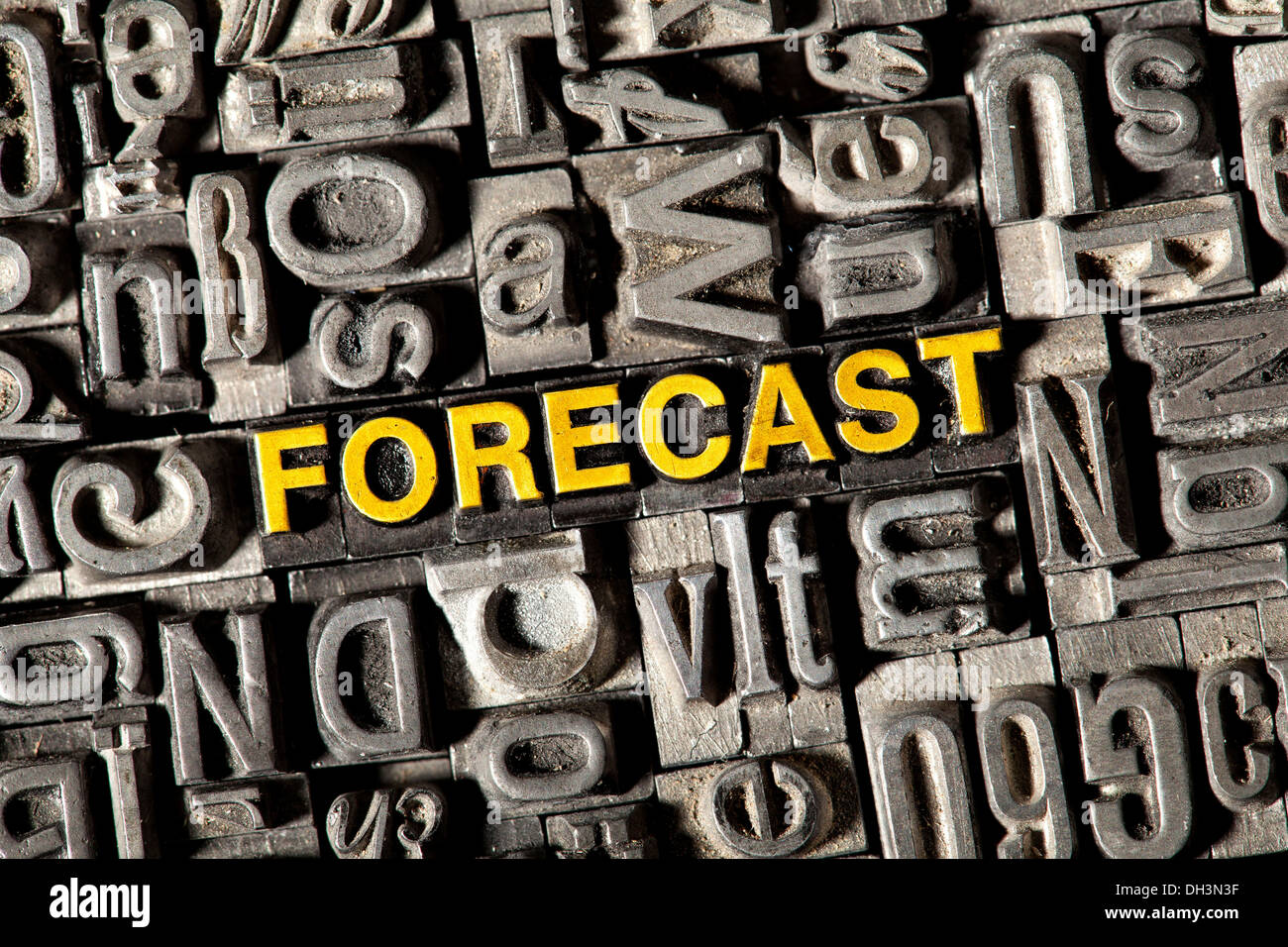 Old lead letters forming the word 'FORECAST' Stock Photo