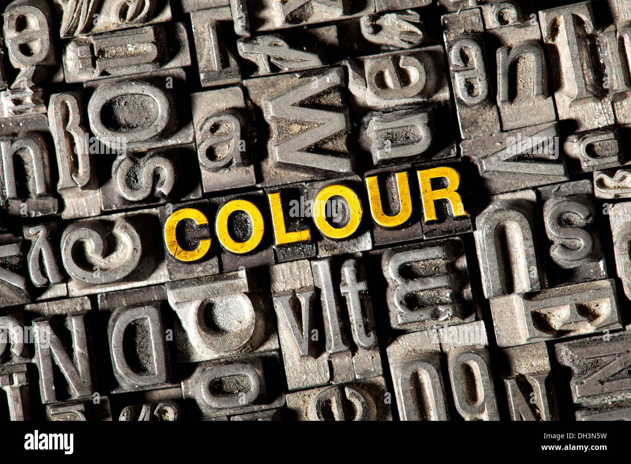 Old lead letters forming the word COLOUR Stock Photo