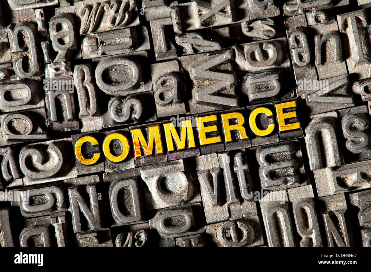 Old lead letters forming the word COMMERCE Stock Photo