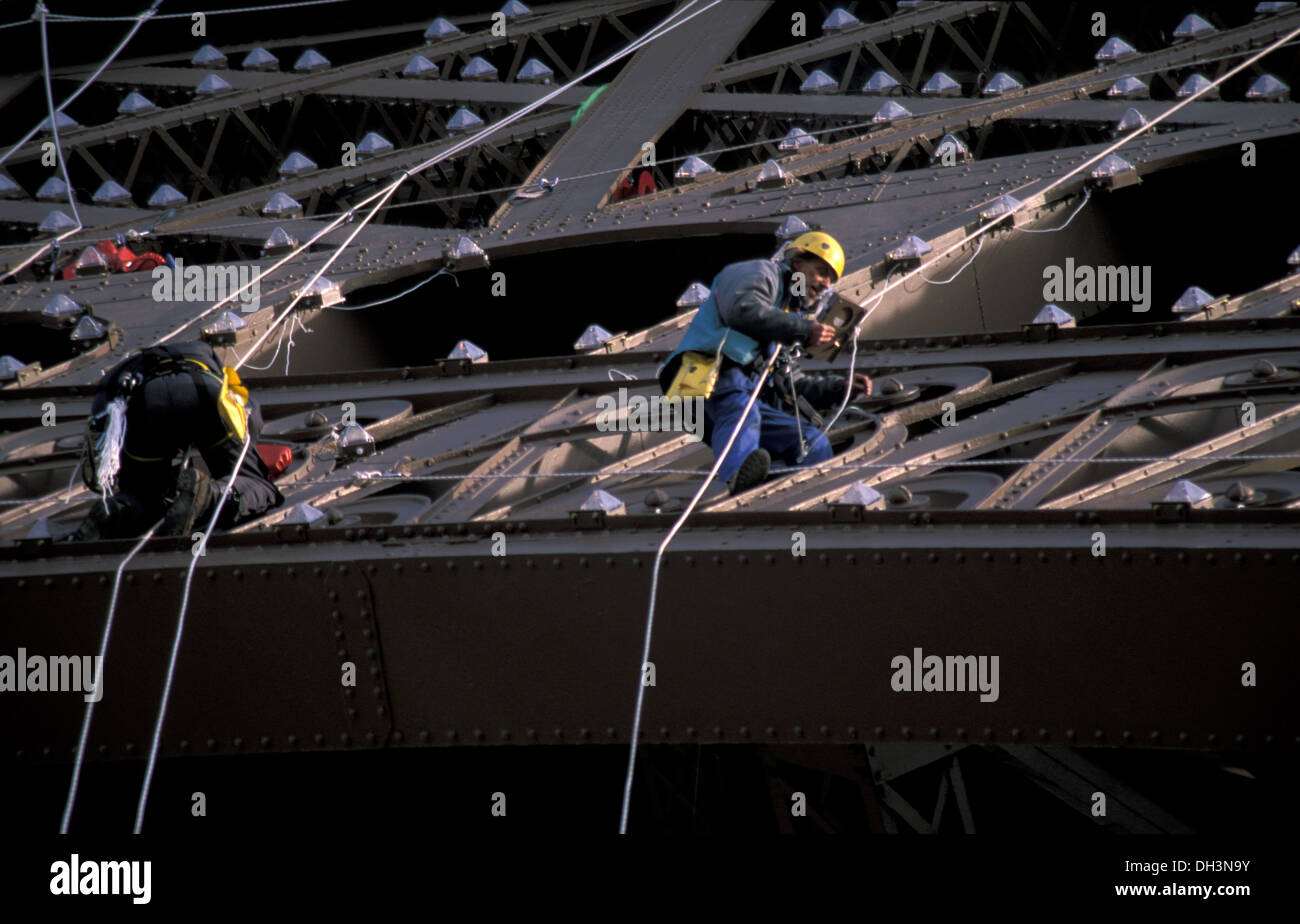 25 mountain climbers installing new lighting installation in the Eiffel Tower, Paris Stock Photo