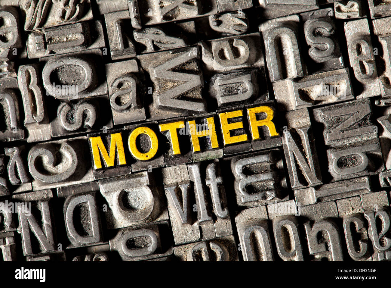 Old lead letters forming the word 'MOTHER' Stock Photo