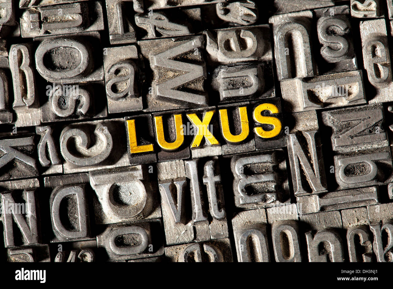 Old lead letters forming the word 'LUXUS', German for 'luxury' Stock Photo