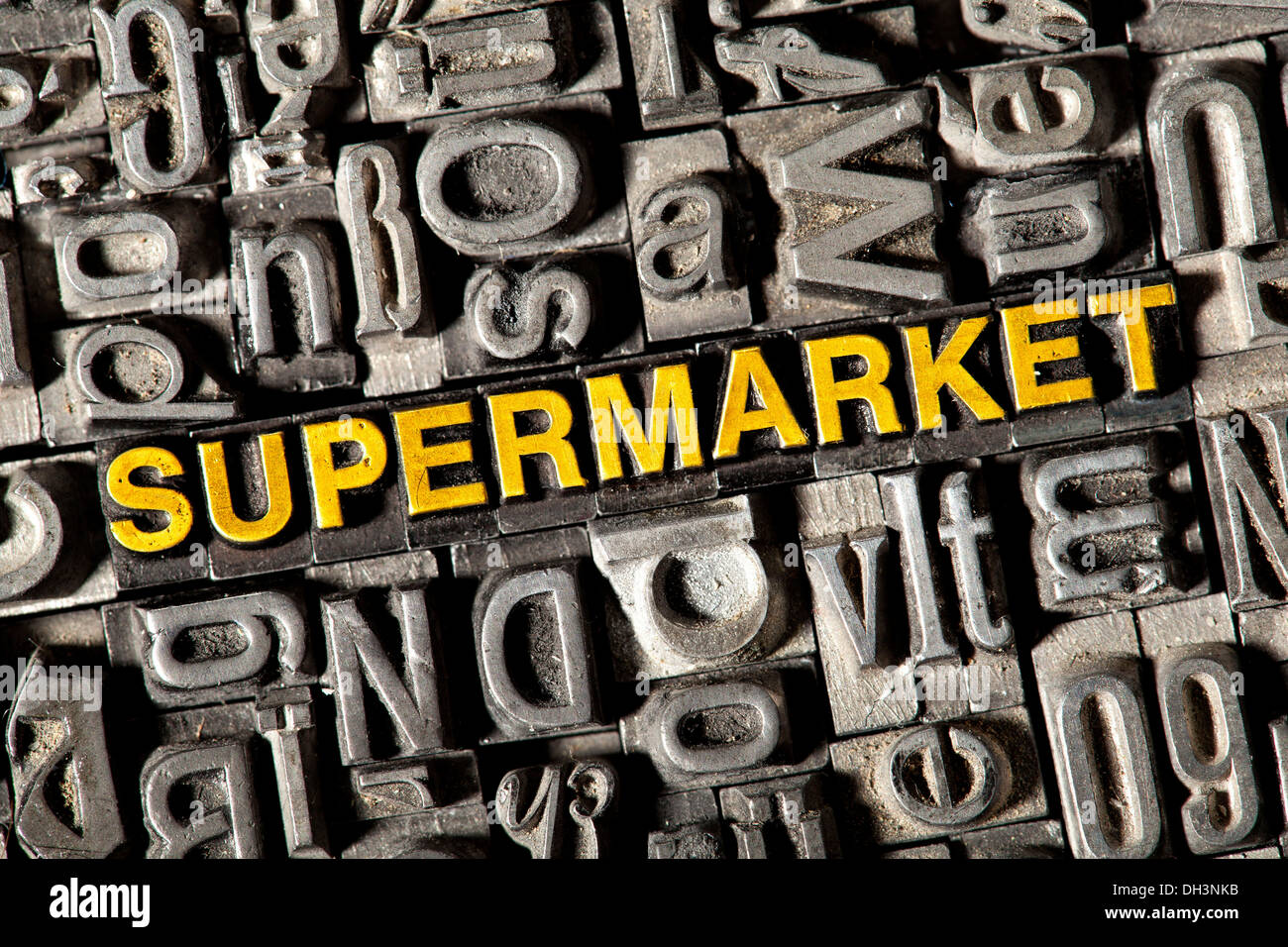 Old lead letters forming the word 'SUPERMARKET' Stock Photo