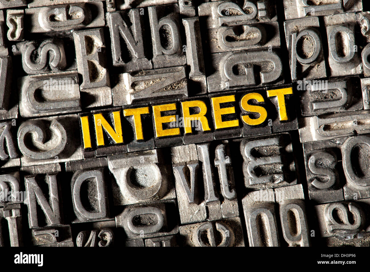 Old lead letters forming the word 'INTEREST' Stock Photo