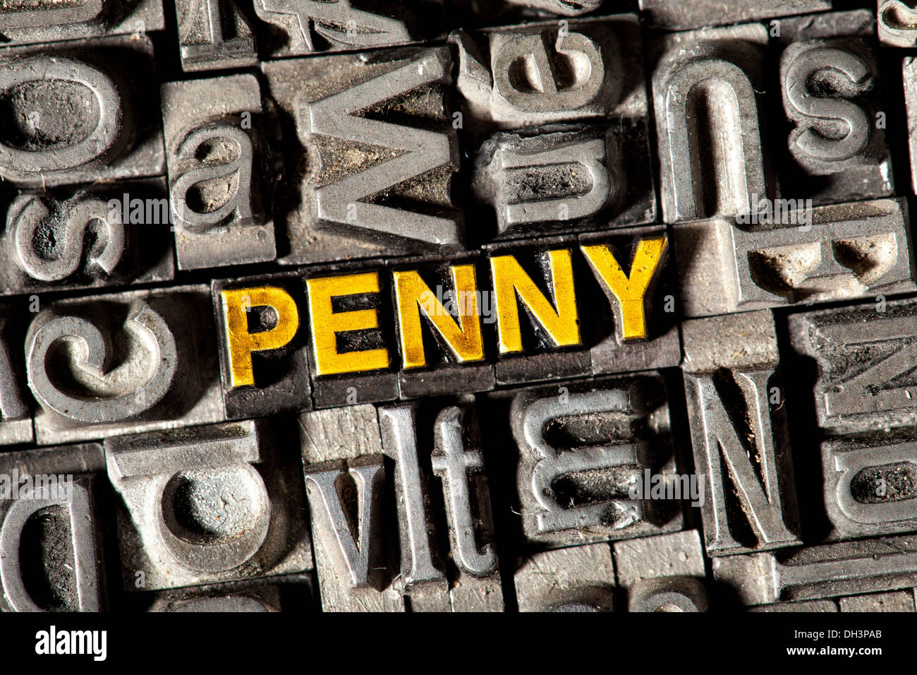 Old lead letters forming the word PENNY Stock Photo