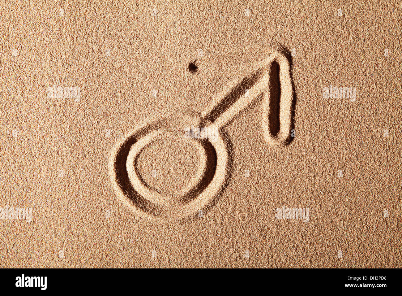 Mars sign, symbol of masculinity, drawn in sand Stock Photo