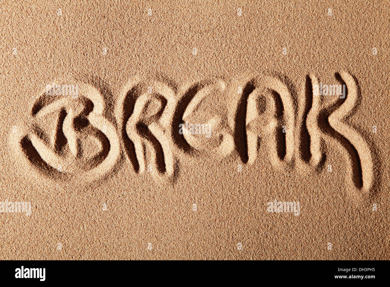 The word BREAK, drawn in sand Stock Photo