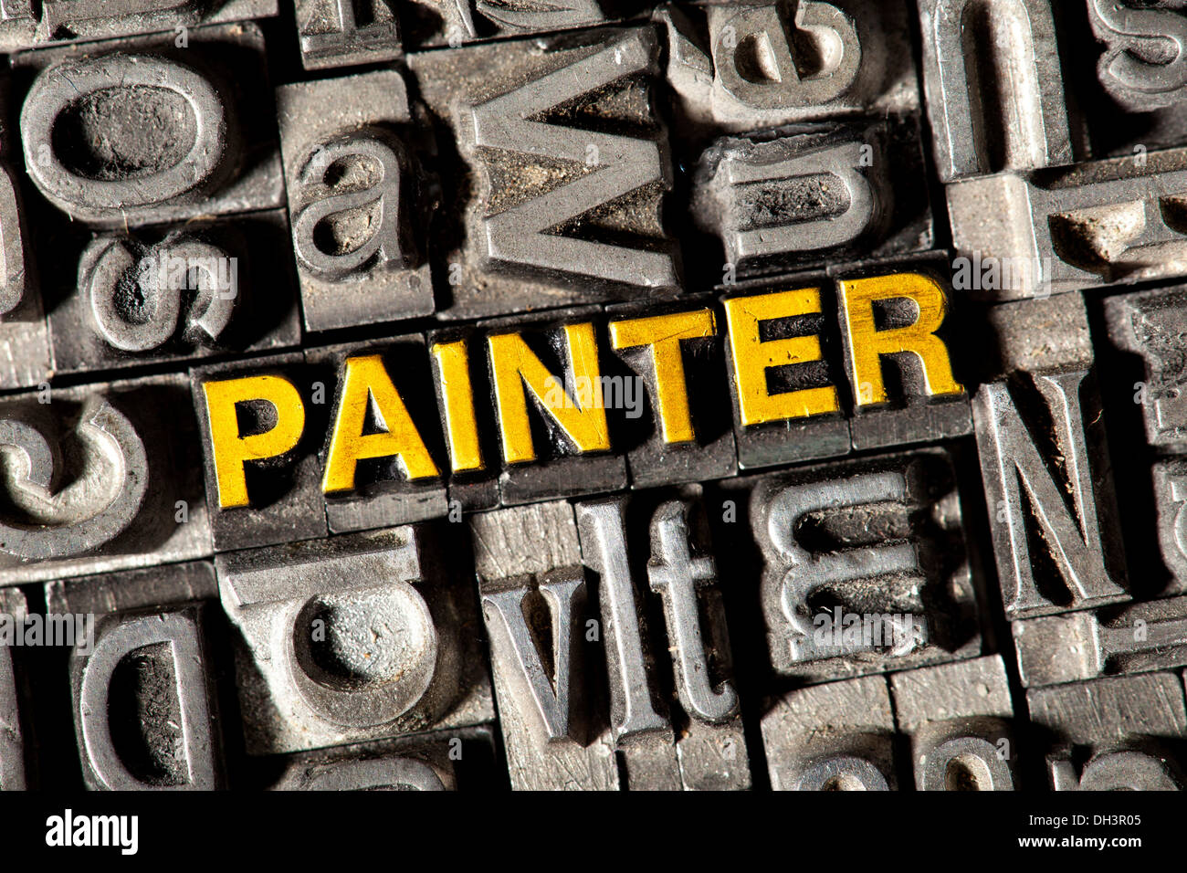Old lead letters forming the word PAINTER Stock Photo