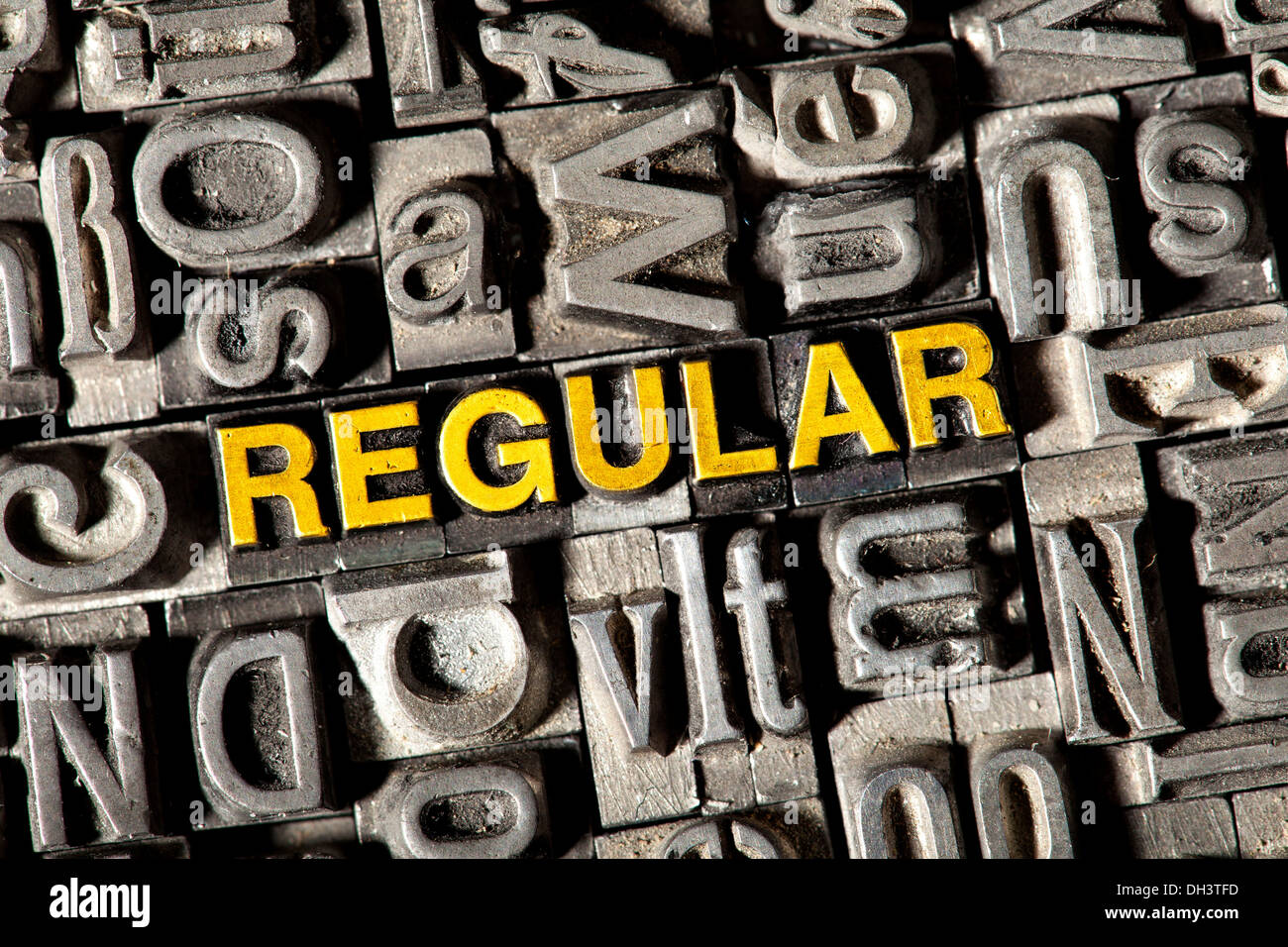 Old lead letters forming the word REGULAR Stock Photo